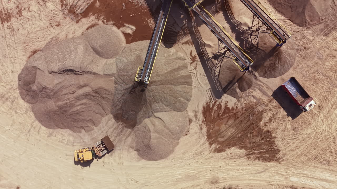 Aerial View of a Sand and Gravel Quarry with Heavy Machinery
