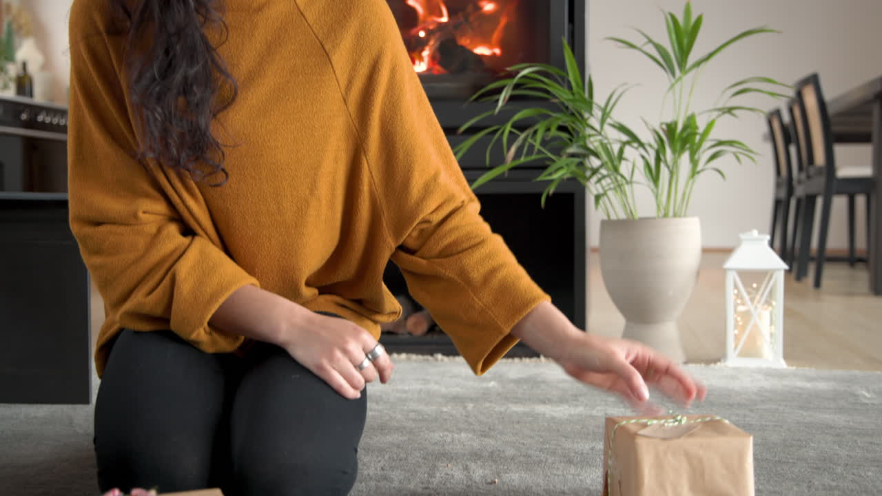 Woman enjoying cozy Christmas moment at home with festive decorations