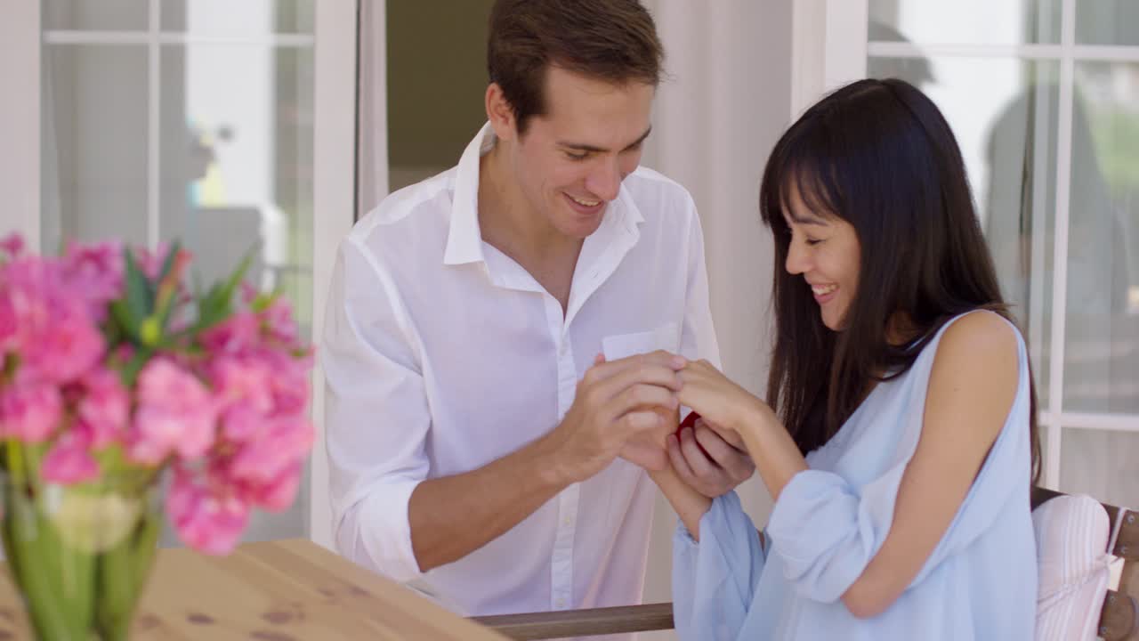Happy young woman accepting a wedding proposal
