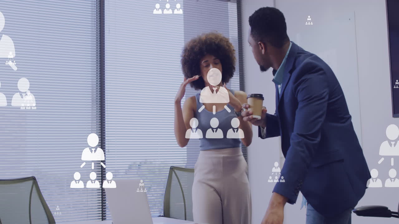 Animation of networking icons and data processing over diverse business people
