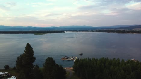 aerial view of calm lake with small jetty