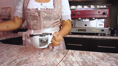 barista making coffee in a cafe