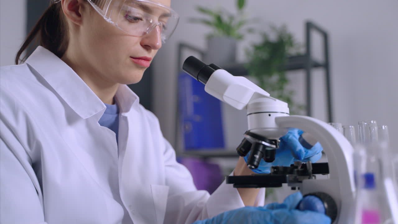 Scientist Using Microscope in a Laboratory
