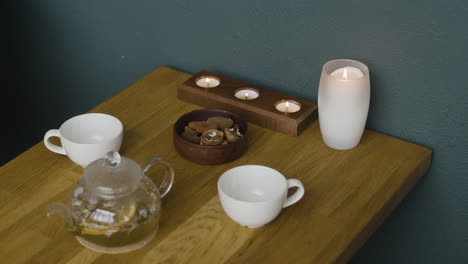 still life of tea set and candles