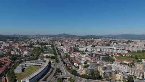 aerial view of braga's cityscape featuring diverse buildings, roads, and sprawling green areas