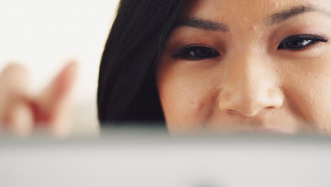 Attractive-young-woman-using-digital-tablet-computer-touchscreen-ipad