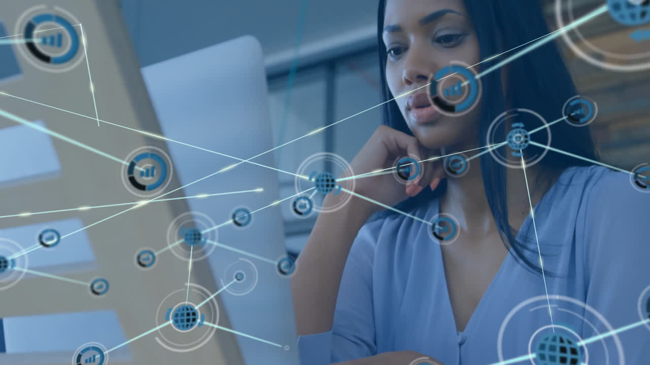 Data processing animation overlay with businesswoman working on laptop in office