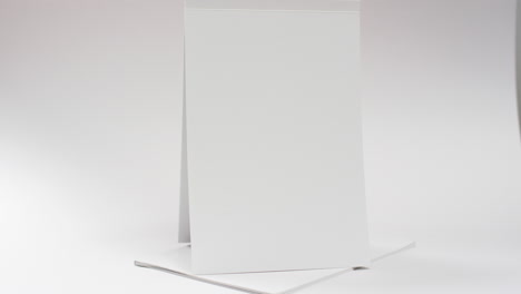 video of books with white blank pages and copy space on white background