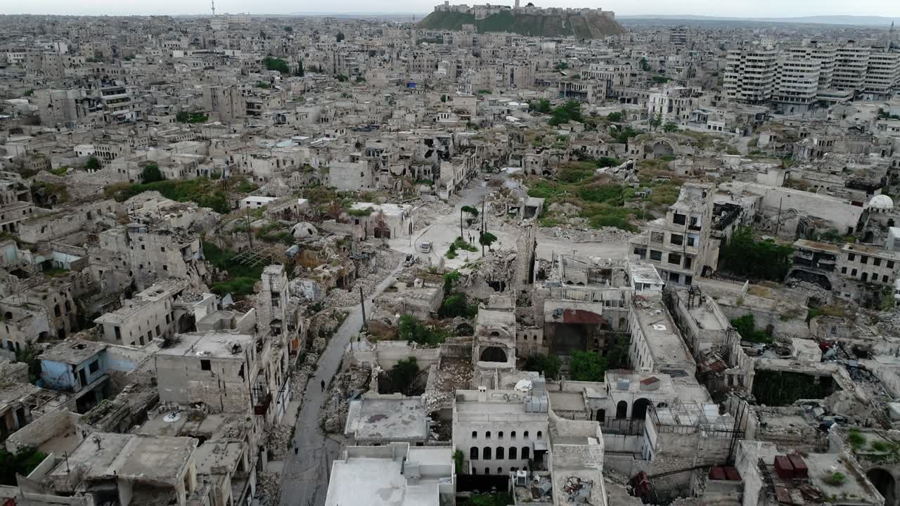 Aleppo in Syria under the sunlight. We can see the city all over the horizon - aerial view 4K