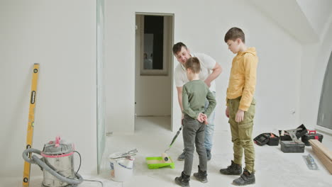 family painting a room together