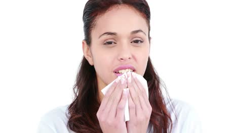 Woman-blowing-nose-with-tissue-paper-