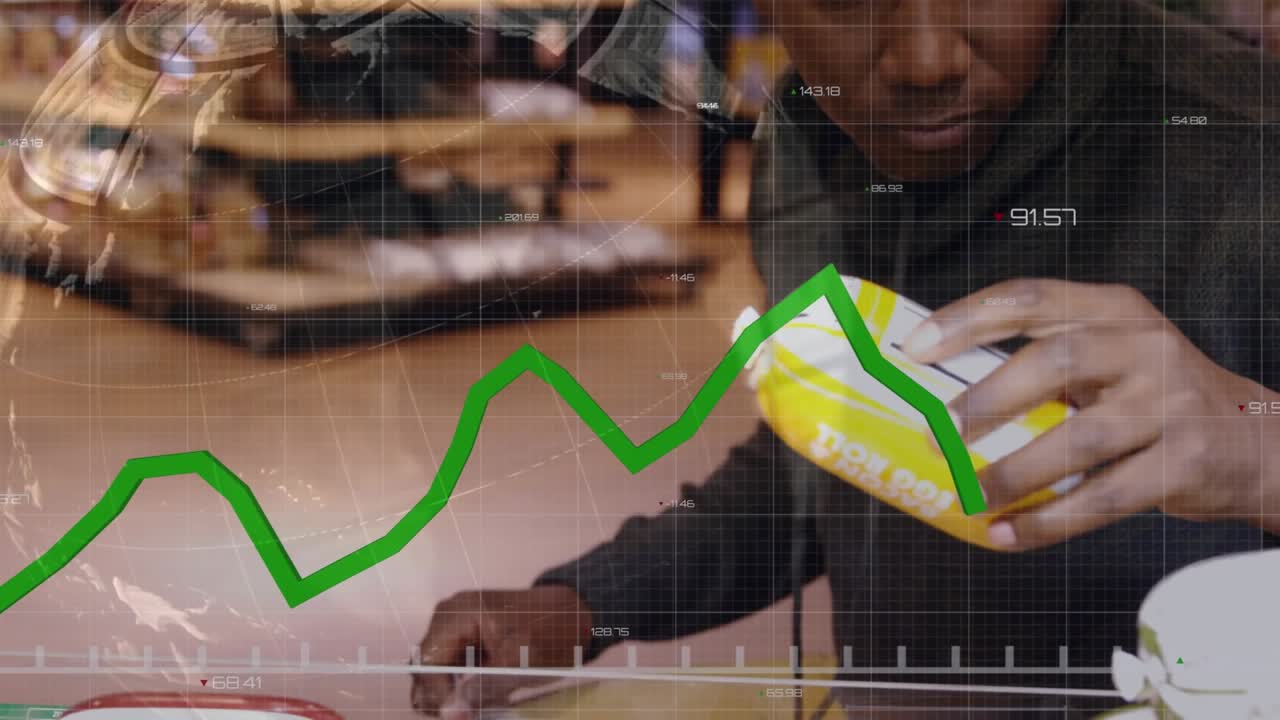 Animation of financial data processing and green line over man using smartphone