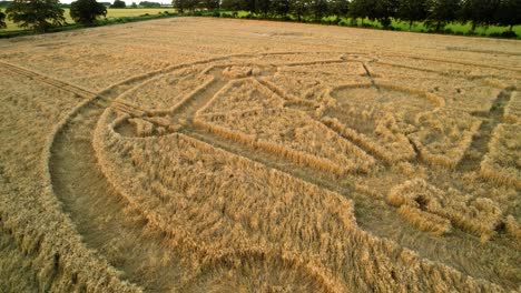 Fortnite-molecular-atom-crop-circle-design-sunset-harvest-meadow-aerial-drone-view-in-Uffcot-push-in-to-low-shot