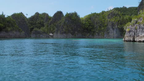 Pianemo-islets-in-Raja-Ampat-archipelago,-Indonesia,-captured-from-a-boat