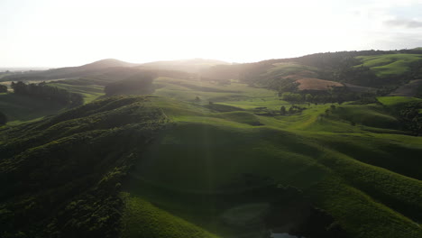 large vast open grass fields between the mountains in southland, new zealand