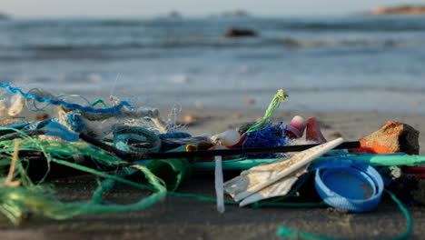 beach in greece covered in rubbish