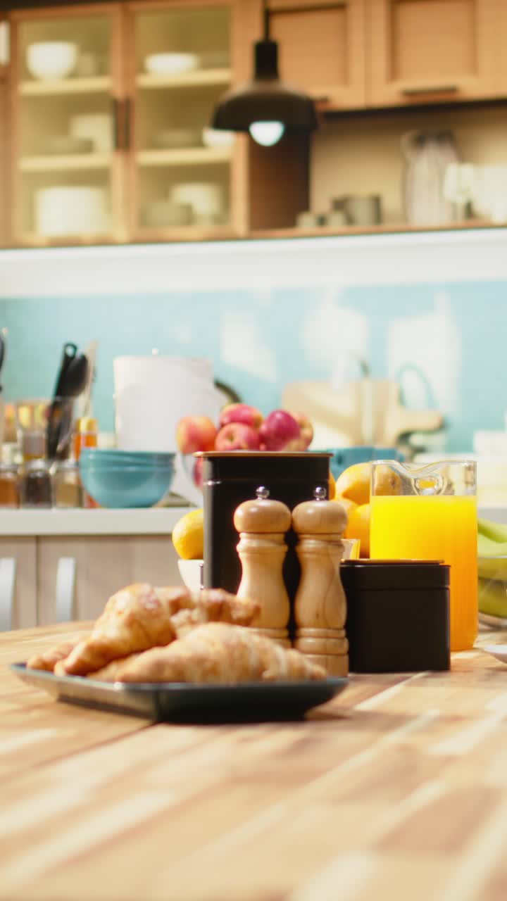 Vertical Video Kitchen interior with croissants and coffee for breakfast meal