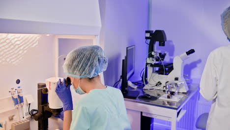 scientists working in a laboratory with advanced microscopy equipment