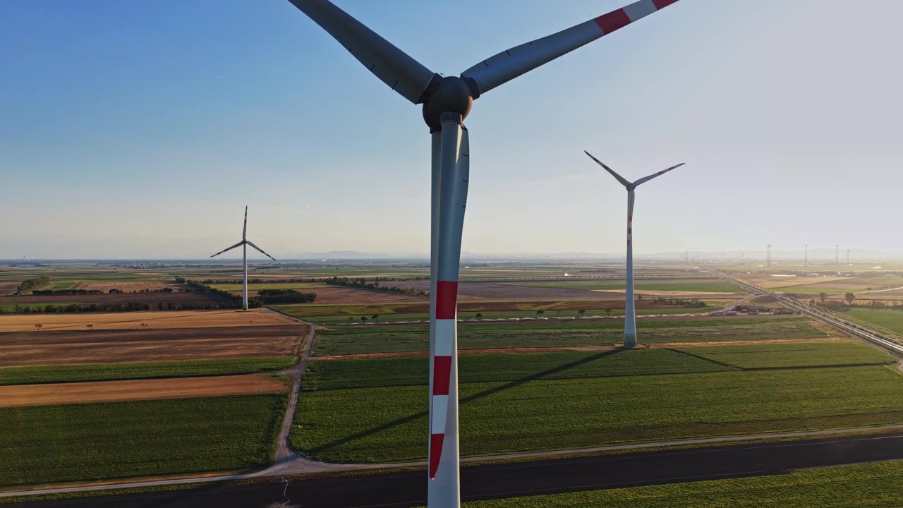Wind turbines in a field during the day in an open landscape