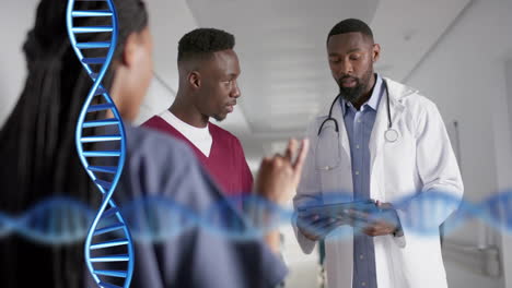 animation of dna strand over diverse doctors in hospital