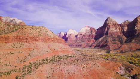 epic aerial reveal of a desert canyon on a sunny day