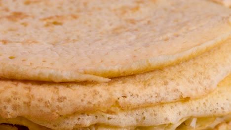 Rotating-pile-of-homemade-pancakes,-close-up-view-macro-shot