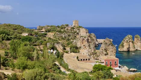 unique panoramic view of stacks or faraglioni of scopello with tonnara or tunnery and torre doria watchtower in sicily