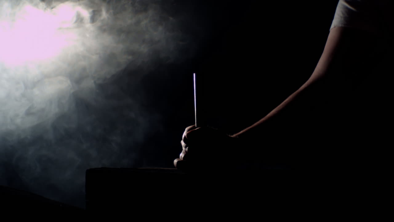 Hammer hitting a big nail in a dramatic misty ambience