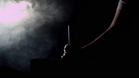 hammer hitting a big nail in a dramatic misty ambience
