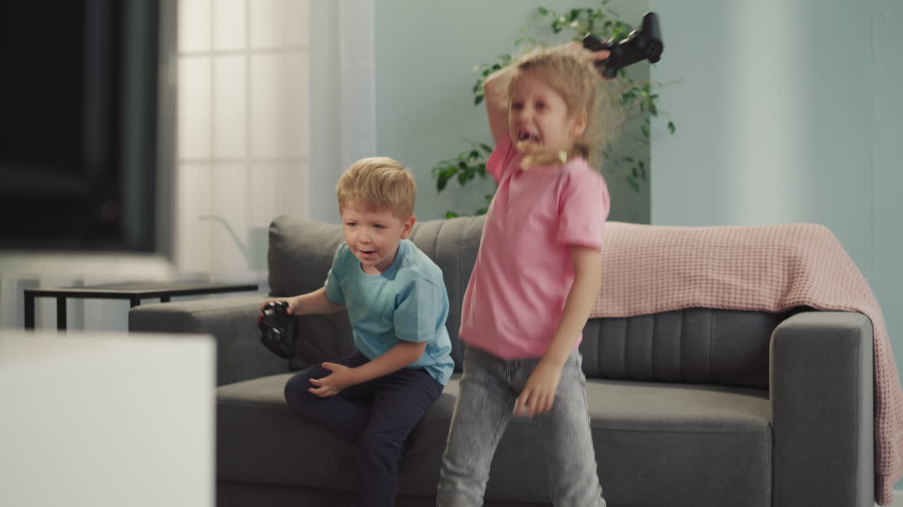 Excited brother and sister feel happy after winning game