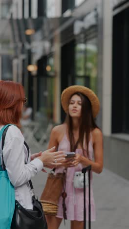 two women talking on the street