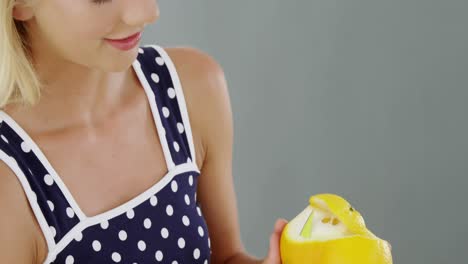 Beautiful-woman-peeling-orange