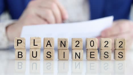 person makes business plan for 2022 closeup