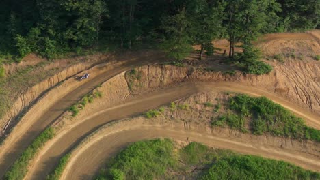 elevated aerial shot showcasing turns and berms of an empty dirt track