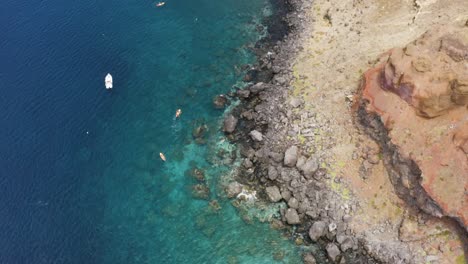 Aerial-is-flying-above-2-kayakers-at-Sao-Laurenco,-Madeira