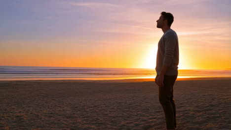 man enjoying a peaceful sunset on the beach