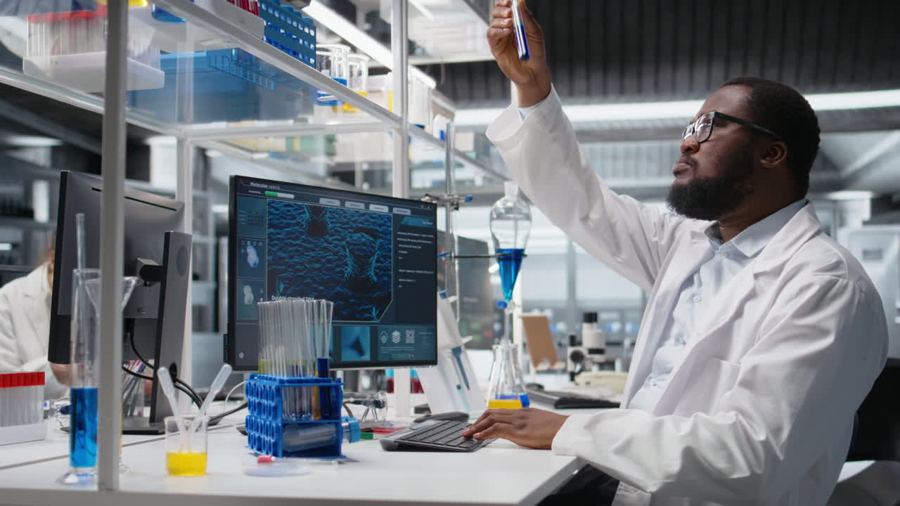 Vertical video Chemical engineer in lab inspecting chemical compounds using PC software