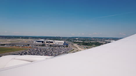 the view from the window of the plane the airliner starts landing