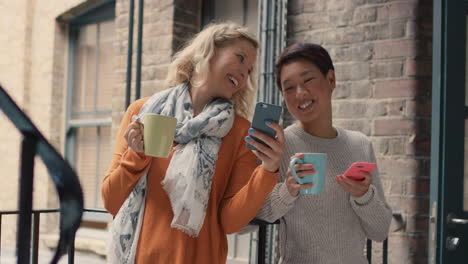 friends hanging out on stairwell using smart phone technology