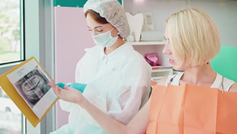 dentist examining patient x-ray