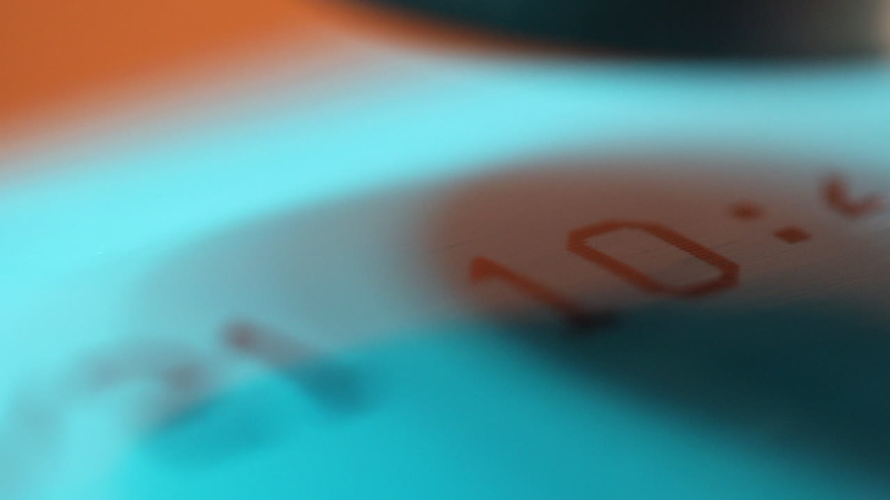 Narrow focus close-up: Thermal printer burns info onto water pipe