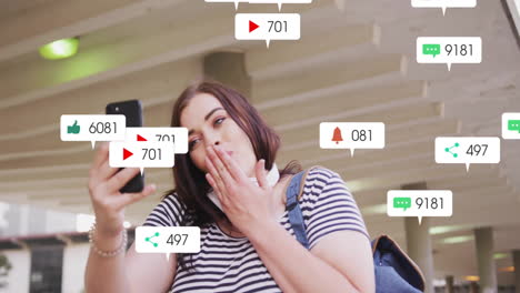 social media engagement animation over woman taking selfie with smartphone