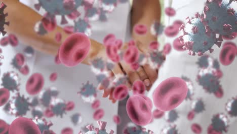 Animation-of-covid-19-cells-over-female-doctor-with-patient