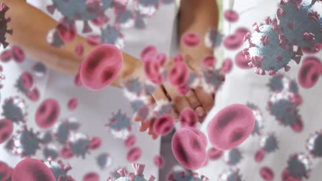 animation of covid 19 cells over female doctor with patient
