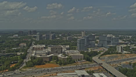 atlanta georgia aerial v675 pan left shot from afar of freeway under construction, green space and cityscape - dji inspire 2, x7, 6k - august 2020