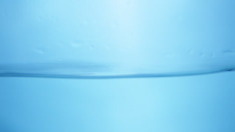 Water-waves-on-surface-with-blue-background_slow-motion