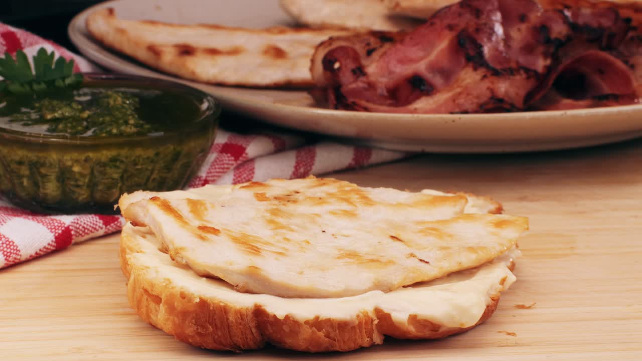 Croissant with jamon ham, Salmon, in Modern Cafe, Top View of Healthy Breakfast in Cafe. English breakfast: fried egg, bacon toast on sandwich.