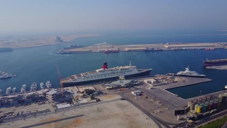 aerial view of a busy port with a cruise ship