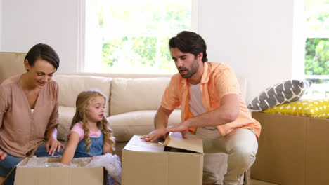 Portrait-of-family-moving-house-