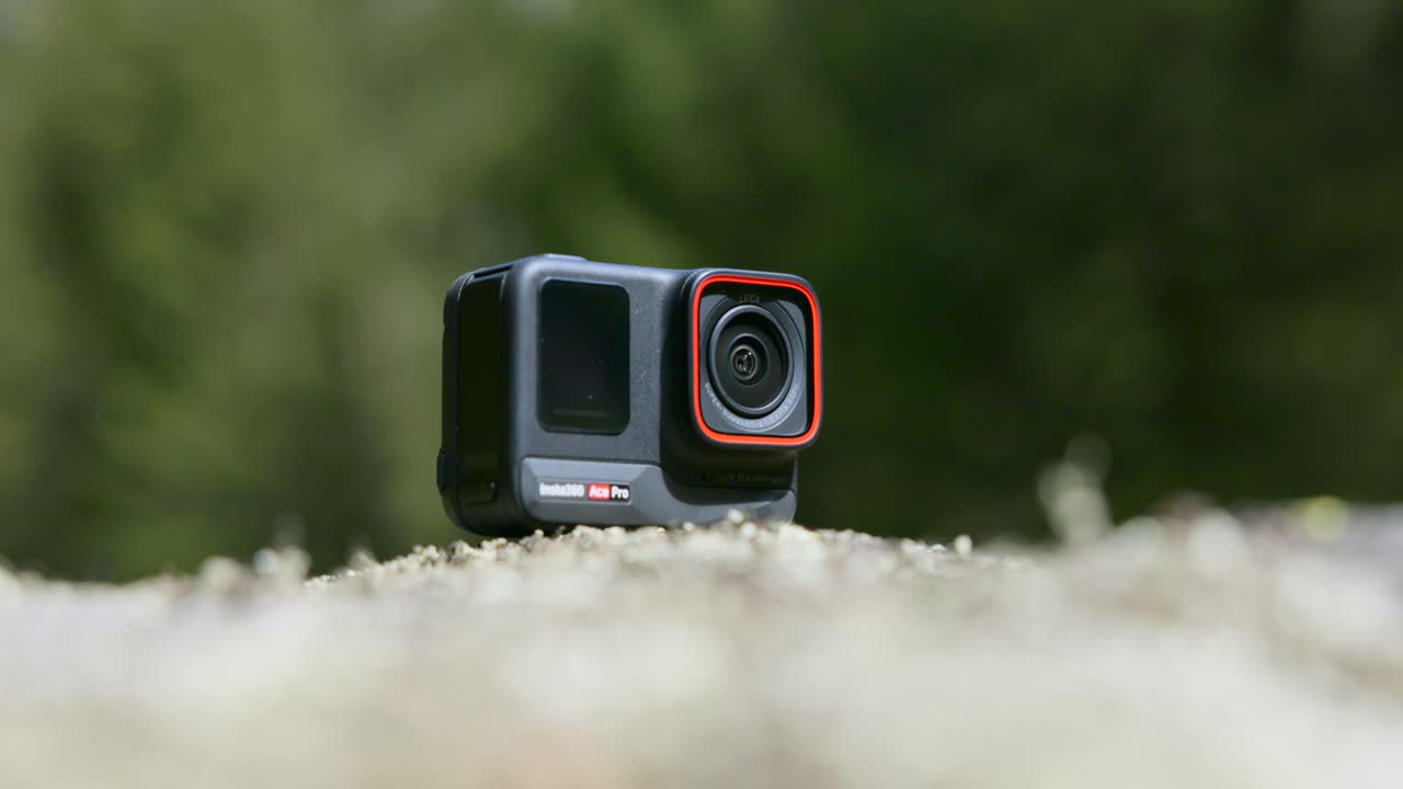 Closeup shot of Action Camera, blurred foreground, outdoor, day